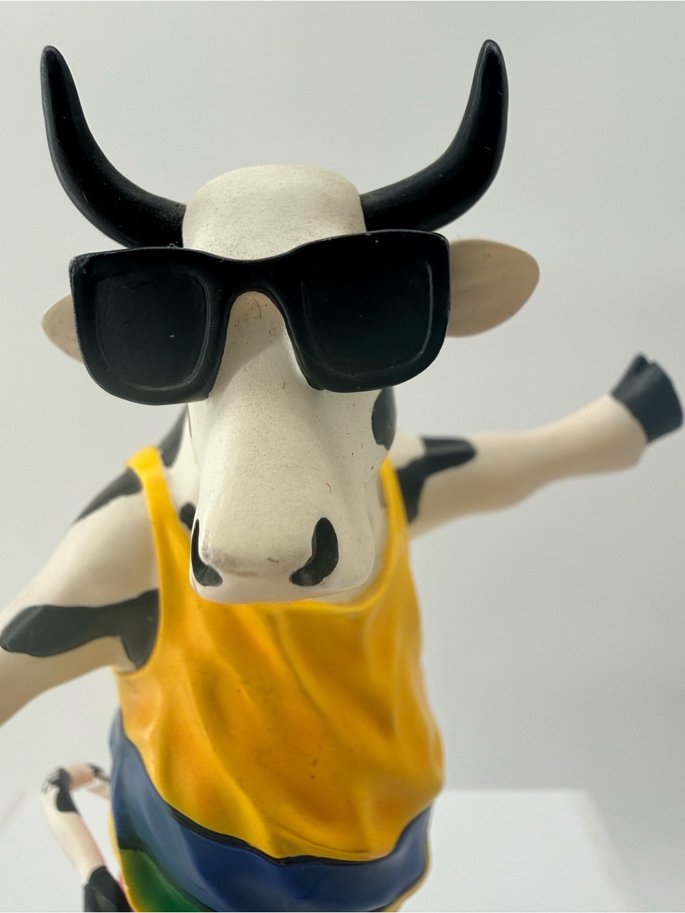 Playful Yellow Cow Figurine with Sunglasses Decorative Accent